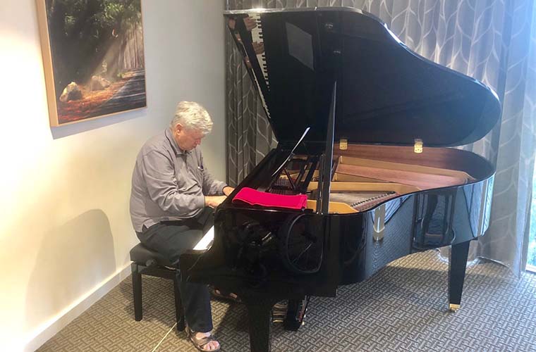 Roy playing the piano