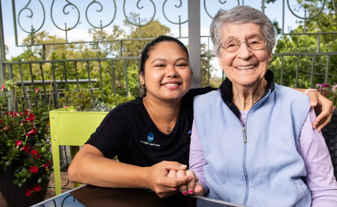 Opal resident and team member smiling