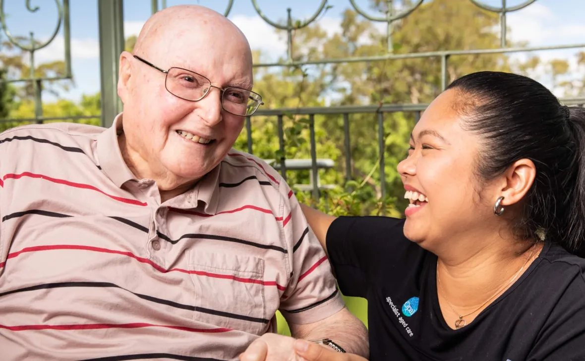 Opal resident and team member laughing together