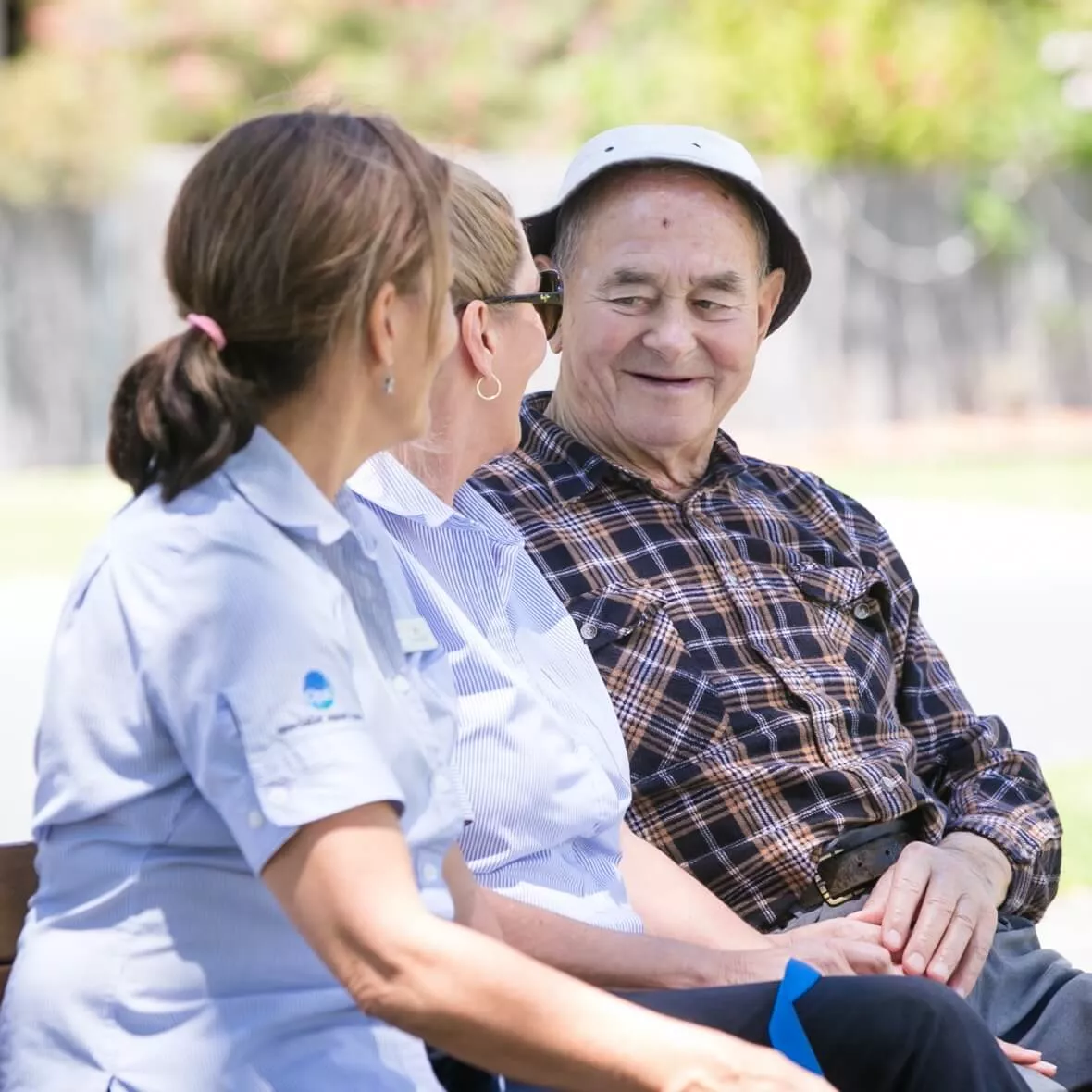 Two Opal team members conversing with a resident