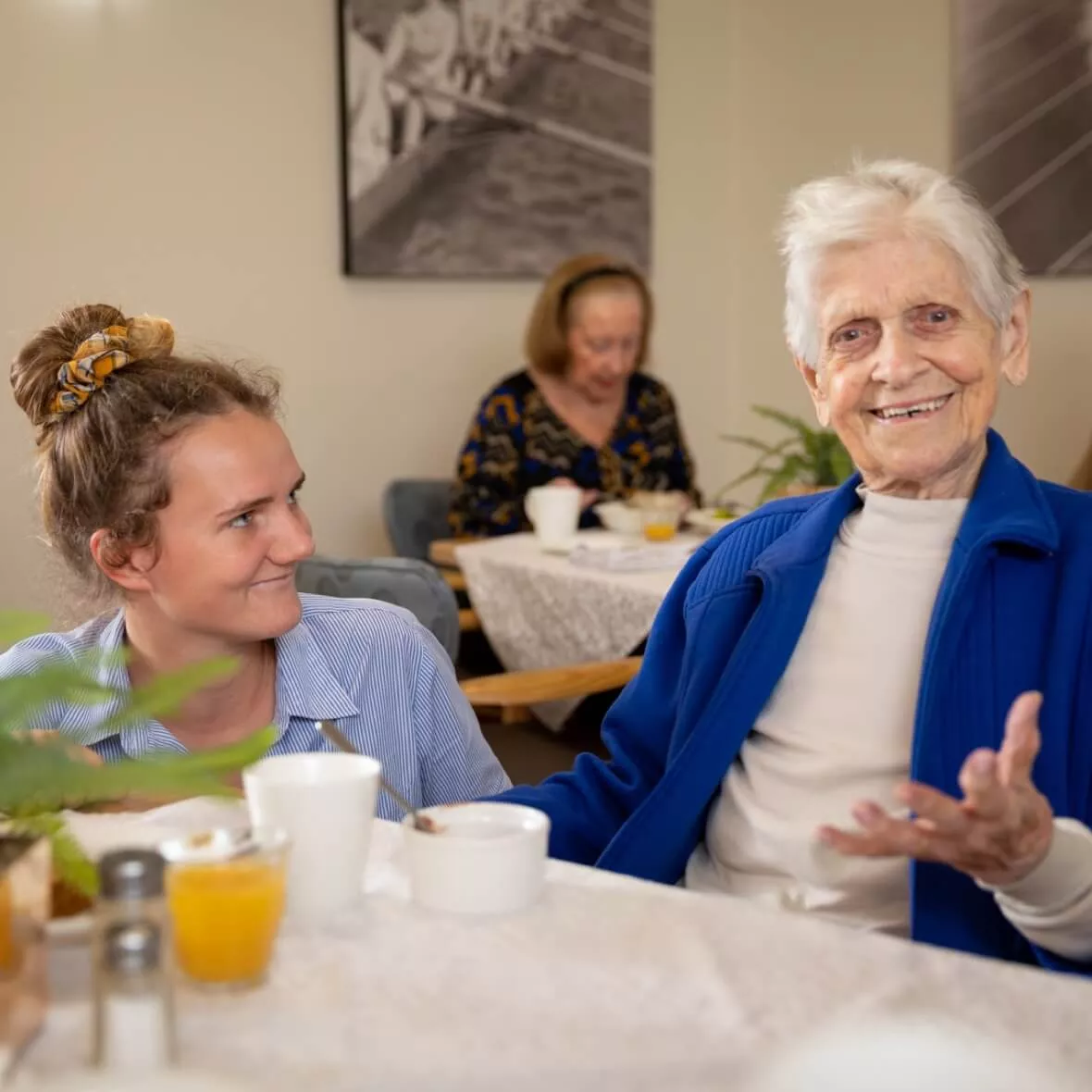 Opal resident and team member at the dinner table