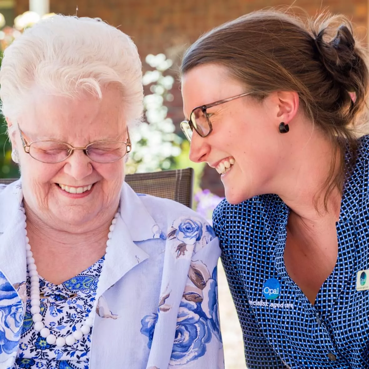 Opal resident and team member laughing